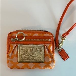 Orange Coach wristlet